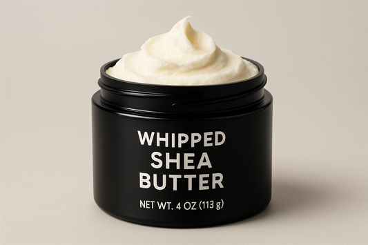 whipped shea butter in a 4oz black plastic jar