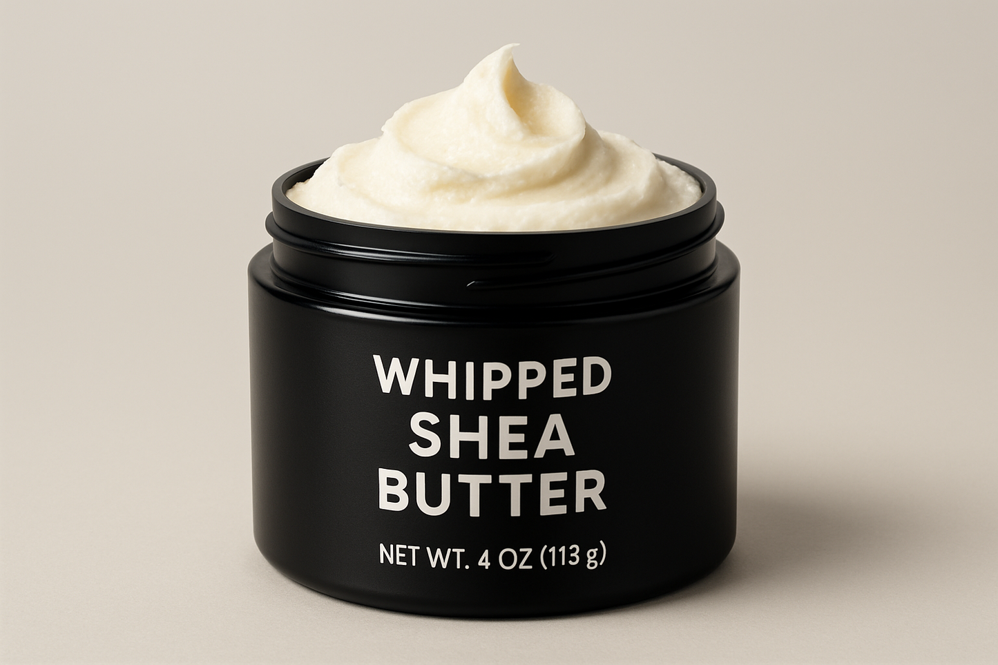 whipped shea butter in a 4oz black plastic jar